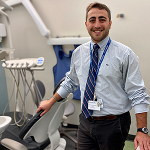 Alec Eidelman, PD19, standing in a dental operatory