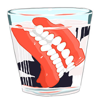 Drawing of a set of dentures soaking in a glass.