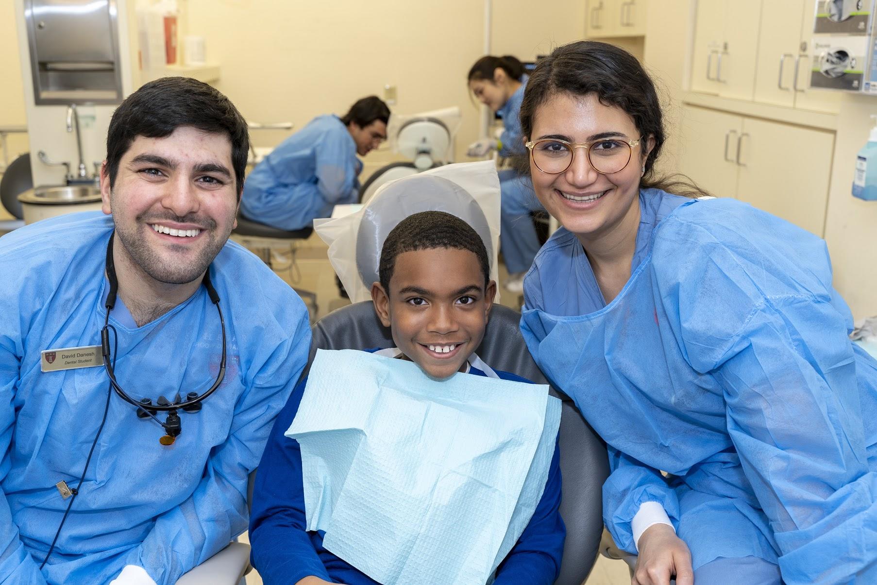 David Danesh, DMD20, provides care with his classmates at the annual Give Kids a Smile event.