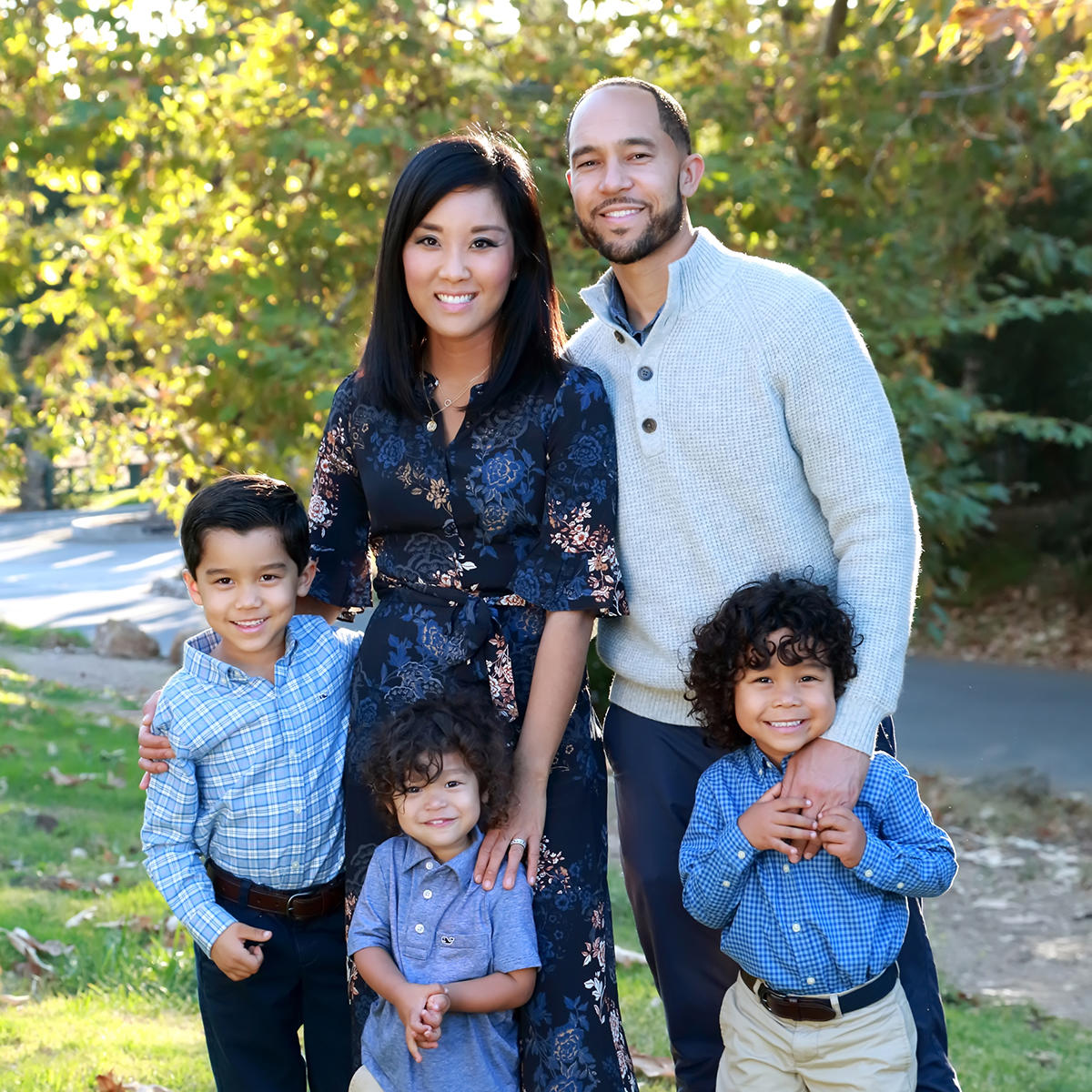 Alice Kim-Bundy, DMD08, and her husband, Michael Bundy, DMD08, pose with their family.