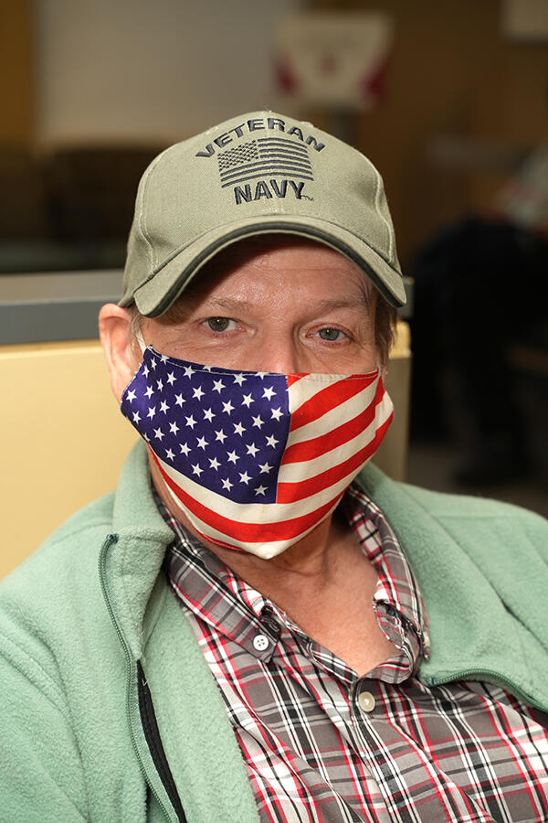 veteran closeup with American flag face mask