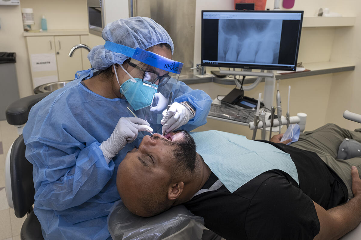 patient in dental chair getting treatment