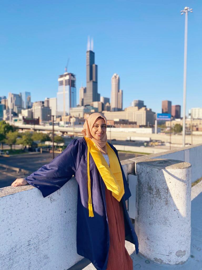 Hoda Mahmoud standing with Chicago skyline behind her