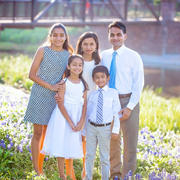 Sandhya Harpavat, DMD02, PD04, and her husband, Sanjiv, PhD06, MD06, with their family.