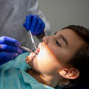 a young boy receiving dental care