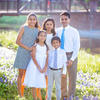 Sandhya Harpavat, DMD02, PD04, and her husband, Sanjiv, PhD06, MD06, with their family.